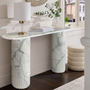 Arabescato Carara Marble Fluted Legs Designer Console Polished (W)16" (L)63" (H)34" installed magazines on top wood floors closeup Arabescato Carara Marble Fluted Legs Designer Console Polished (W)16" (L)63" (H)34" installed magazines on top wood floors closeup