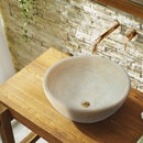 Beige Travertine Natural Stone Vessel Sink Honed and Filled (D)16" (H)6" SKU-NTRSTC09 installed on bathroom above counter Beige Travertine Natural Stone Vessel Sink Honed and Filled (D)16" (H)6" SKU-NTRSTC09 installed on bathroom above counter