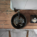Toros Black Marble Vessel Sink rough exterior SKU-NTRVS24 size (D)16" (H)6" installed on bathroom above-counter Toros Black Marble Vessel Sink rough exterior SKU-NTRVS24 size (D)16" (H)6" installed on bathroom above-counter