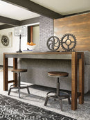 Torjin - 3 Pc. - Long Counter Table, 2 Stools - Dark Brown