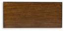 Taffenbrook - Five Drawer Chest - Medium Brown