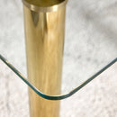 A modern minimalist style glass dining table. Transparent tempered glass tabletop with a thickness of 0.3 feet and golden metal legs. Suitable for restaurants and living rooms. 51"x31.4"x29.5"
