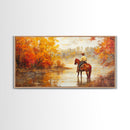 Cowboy sitting by campfire near a lake in the woods with autumn leaves, Framed Canvas Print, moody fall wall art, rustic western home decor