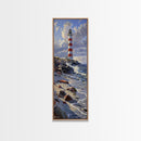 Framed Canvas Print Skinny Art of a Majestic Lighthouse Standing Tall Against a Bright Blue Sky with Waves Crashing on Rocky Shores, Perfect Tall Art