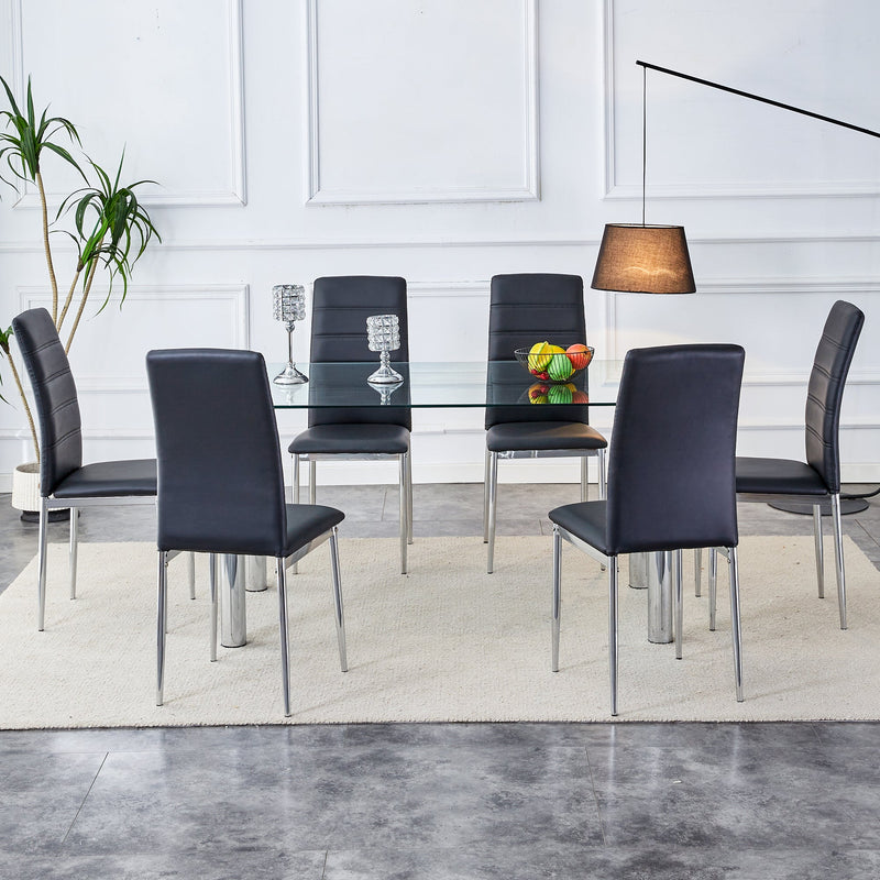 A modern minimalist style glass dining table. Transparent tempered glass tabletop with a thickness of 0.3 feet and silver metal legs. Suitable for restaurants and living rooms. 63 "x 35.4" x 30"
