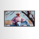 Autumn-themed portrait Framed Canvas Print of a woman in a cowboy hat holding a cup of coffee, surrounded by fall leaves, cozy fall decor
