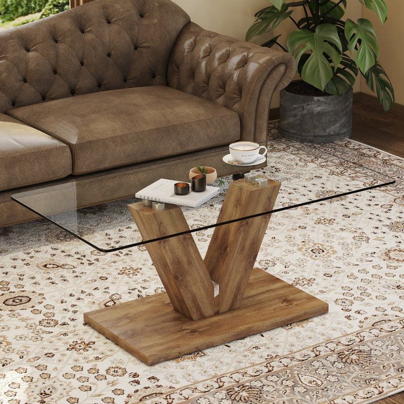 A modern minimalist style coffee table. Transparent tempered glass tabletop with wooden MDF columns. Suitable for living room and dining room. CT-V