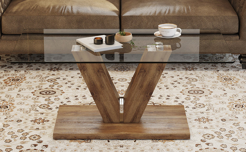A modern minimalist style coffee table. Transparent tempered glass tabletop with wooden MDF columns. Suitable for living room and dining room. CT-V