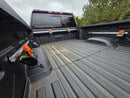 Truck bed tie down system