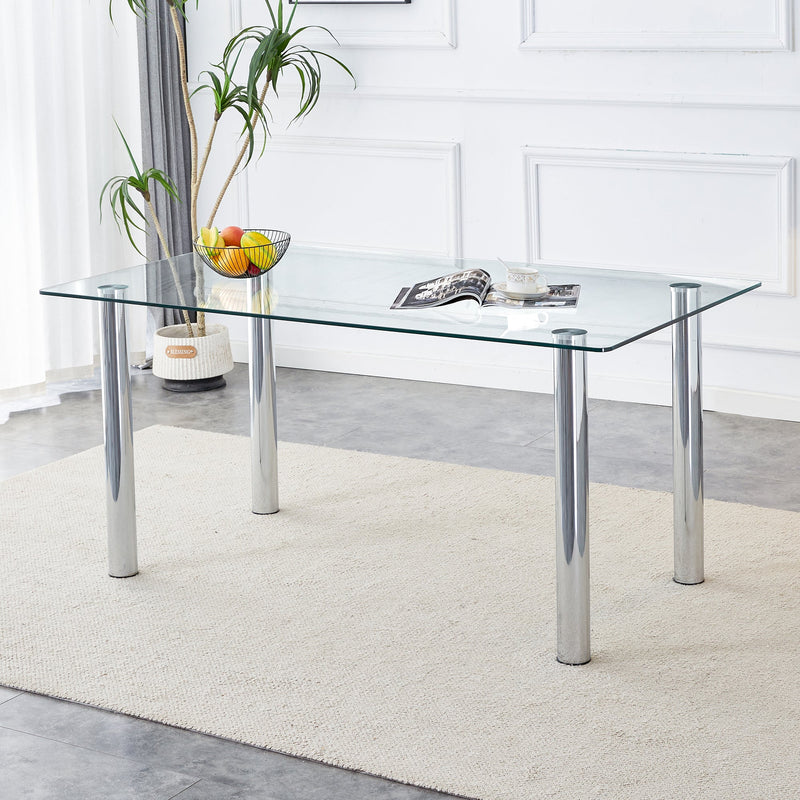 A modern minimalist style glass dining table. Transparent tempered glass tabletop with a thickness of 0.3 feet and silver metal legs. Suitable for restaurants and living rooms. 63 "x 35.4" x 30"