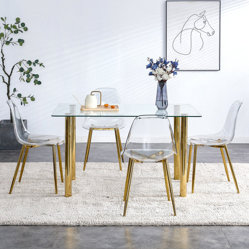 A modern minimalist style glass dining table. Transparent tempered glass tabletop with a thickness of 0.3 feet and golden metal legs. Suitable for restaurants and living rooms. 51"x31.4"x29.5"