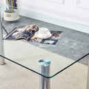 A modern minimalist style glass dining table. Transparent tempered glass tabletop with a thickness of 0.3 feet and silver metal legs. Suitable for restaurants and living rooms. 63 "x 35.4" x 30"