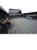 Truck bed tie down system