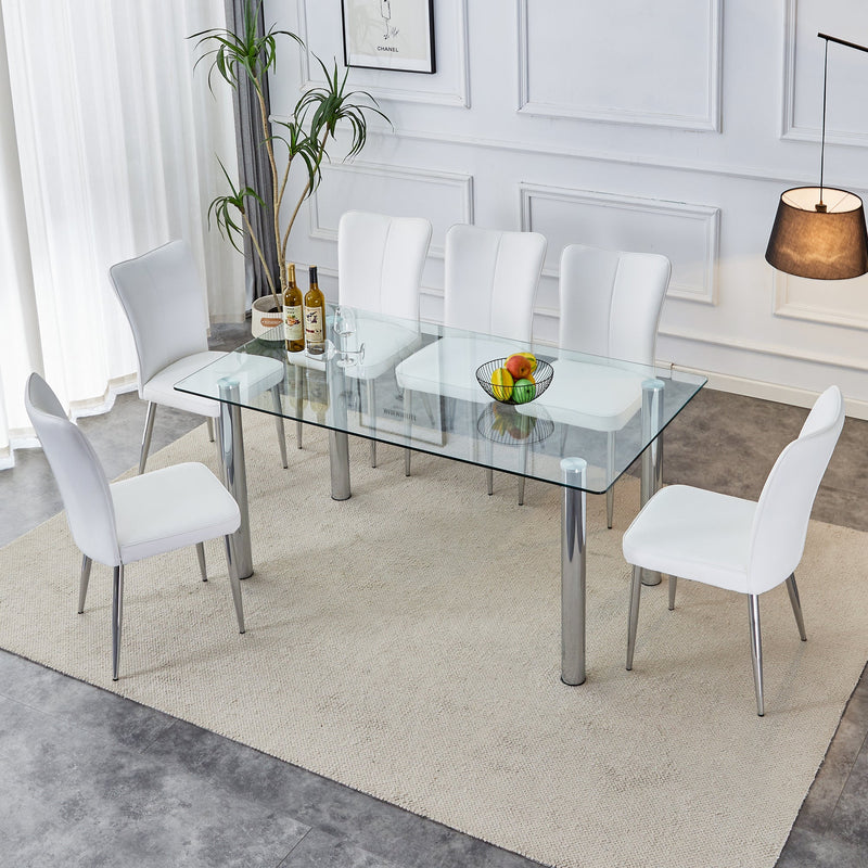 A modern minimalist style glass dining table. Transparent tempered glass tabletop with a thickness of 0.3 feet and silver metal legs. Suitable for restaurants and living rooms. 63 "x 35.4" x 30"