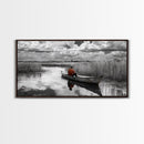 Solitary Canoe, Peaceful Waters, Cloudy Sky, Red Shirt, Framed Canvas Print, Nature Explorer Gift, Cabin Wall Art, Rustic Fall Scene