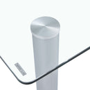 A modern minimalist style glass dining table. Transparent tempered glass tabletop with a thickness of 0.3 feet and silver metal legs. Suitable for restaurants and living rooms. 63 "x 35.4" x 30"