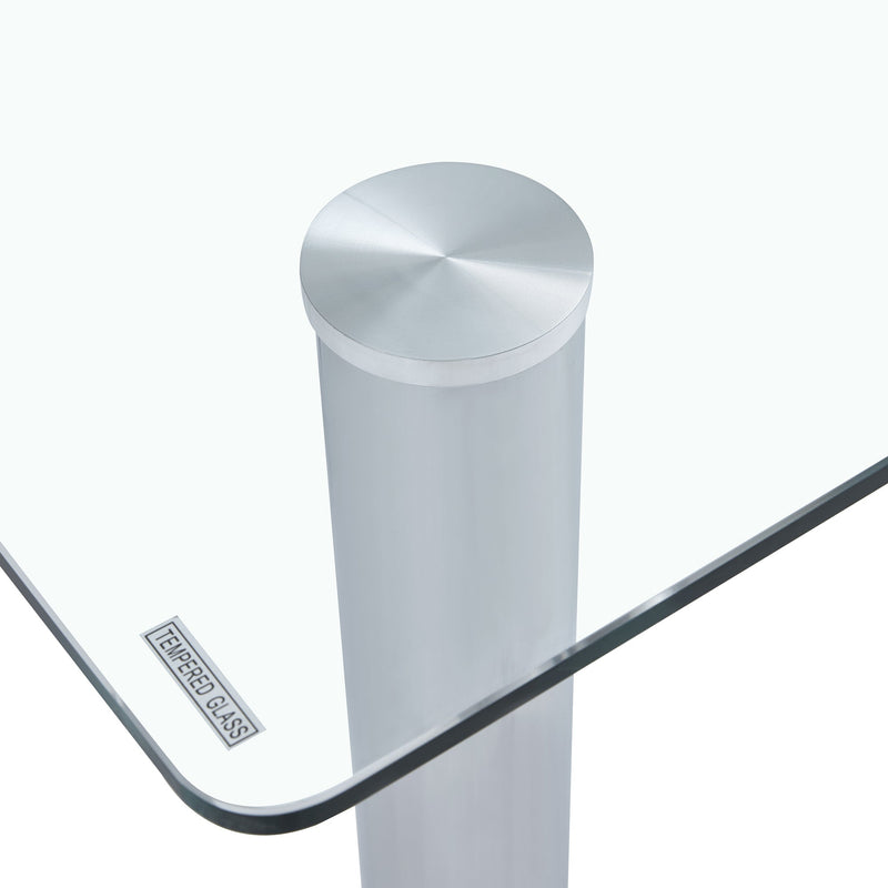 A modern minimalist style glass dining table. Transparent tempered glass tabletop with a thickness of 0.3 feet and silver metal legs. Suitable for restaurants and living rooms. 63 "x 35.4" x 30"