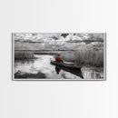 Solitary Canoe, Peaceful Waters, Cloudy Sky, Red Shirt, Framed Canvas Print, Nature Explorer Gift, Cabin Wall Art, Rustic Fall Scene
