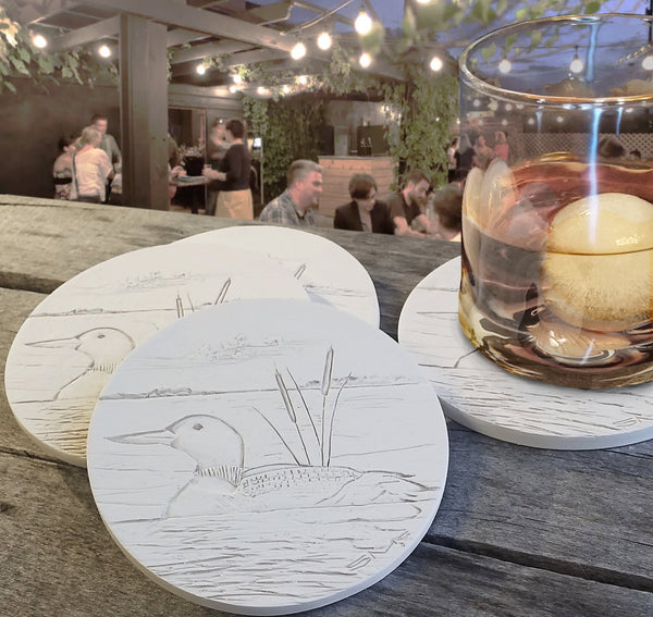 Loon Coasters, installed in a room