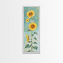 Japanese Skinny Art of Sunflowers with Golden Petals and Verdant Stems on a Pastel Blue Background – Framed Canvas Print