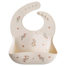 mushie Silicone Baby Bib | Adjustable Fit Waterproof Bibs (Pink Flowers) by TinyTreasures Baby Boutique