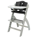 Abiie Beyond Junior Wooden High Chair with Tray - Adjustable and Convertible High Chair for Babies and Toddlers - 6 Months to 250 Lb - Water Resistant - Misty Grey Wood/Black Pearl Cushion by TinyTreasures Baby Boutique