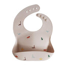 mushie Silicone Baby Bib | Adjustable Fit Waterproof Bibs (Dinosaurs) by TinyTreasures Baby Boutique