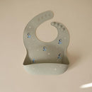 mushie x Bluey Silicone Baby Bib | Adjustable Fit Waterproof Bibs (Bluey Sage) by TinyTreasures Baby Boutique