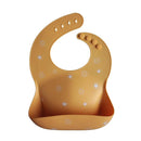 mushie Silicone Baby Bib | Adjustable Fit Waterproof Bibs (Sun Orange) by TinyTreasures Baby Boutique