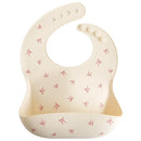 mushie Silicone Baby Bib | Adjustable Fit Waterproof Bibs (Bows) by TinyTreasures Baby Boutique