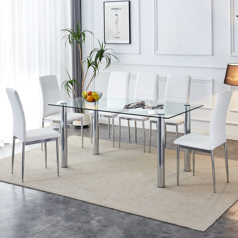 A modern minimalist style glass dining table. Transparent tempered glass tabletop with a thickness of 0.3 feet and silver metal legs. Suitable for restaurants and living rooms. 63 "x 35.4" x 30"