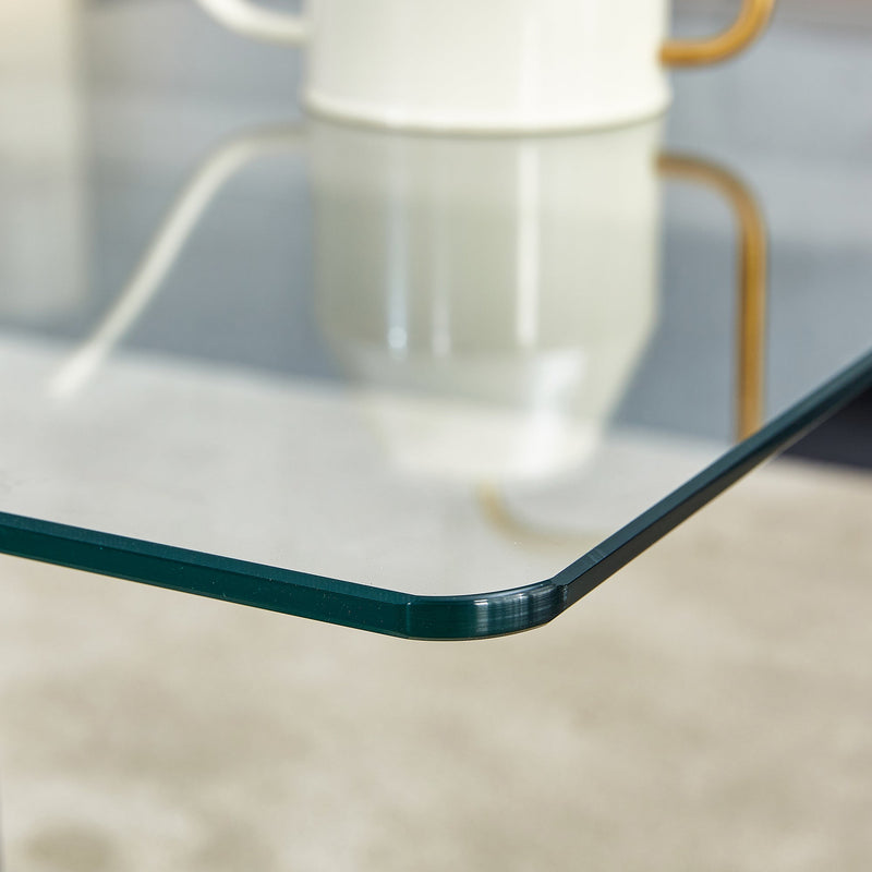 A rectangular modern and fashionable coffee table with tempered glass tabletop and black MDF legs. Suitable for living room.47.2"x25.5"x18"