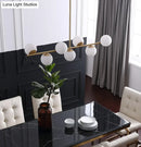 GobekUsa 7-Light Modern Gold Metal Island Pendant with Spherical White Glass - Ideal for Dining Table