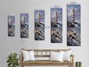 Framed Canvas Print Skinny Art of a Majestic Lighthouse Standing Tall Against a Bright Blue Sky with Waves Crashing on Rocky Shores, Perfect Tall Art