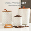 JOJUNO White Ceramic Canister Set with Wooden Lids – 3-Piece Airtight Food Storage Jars for Kitchen, Embossed Design, Small/Medium/Large Sizes (12/30/48 oz) – Flour, Sugar, Coffee, Tea Containers by CozyNest Decor