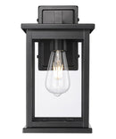11"H Bowton II Outdoor Wall Light - Dusk to Dawn Matte Black Finish with Glass Shade by Millennium Lighting