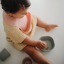 mushie Silicone Baby Bib | Adjustable Fit Waterproof Bibs (Powder Pink Confetti) by TinyTreasures Baby Boutique