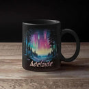Personalized Winter Landscape Coffee Mug, Custom Northern Lights Ceramic Cup, Enchanted Forest With Vibrant Sky Mug, Custom Choose Name Black Mug 11oz 15oz, Gift For Nature Lovers by CozyNest Decor