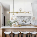 KCO Lighting 6 Light Bubble Chandelier Lighting Clear Glass Globe Chandelier Brass Gold Linear Pendant Light Mid Century Modern Pendant Light for Living Room Kitchen Island Dining Room by CozyNest Decor