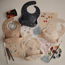mushie Silicone Baby Bib | Adjustable Fit Waterproof Bibs (Rocket Ship) by TinyTreasures Baby Boutique