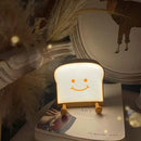 QANYI Toast Bread Night Light,Soft LED Toast Lamp with Cute Face Always Smile,Bedroom Table Lamps Graduation Gifts Ideas for Teen Girls 10 11 12 13 14 Year Old Girls by TinyTreasures Baby Boutique