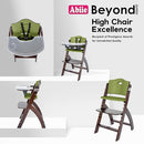 Abiie Beyond Junior Wooden High Chair with Tray - Adjustable and Convertible High Chair for Babies and Toddlers - 6 Months to 250 Lb - Water Resistant - Mahogany Wood/Olive Cushion by TinyTreasures Baby Boutique