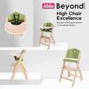 Abiie Beyond Junior Wooden High Chair with Tray - Adjustable and Convertible High Chair for Babies and Toddlers - 6 Months to 250 Lb - Water Resistant - Natural Wood/Olive Cushion by TinyTreasures Baby Boutique