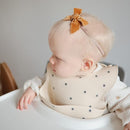 mushie Silicone Baby Bib | Adjustable Fit Waterproof Bibs (Black Daisy) by TinyTreasures Baby Boutique