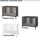 Child Craft London Mini Compact Folding Portable Crib with 2” Crib Mattress and 2 Easy Roll Locking Wheels, Durable Pine Wood Construction (Ebony Black) by TinyTreasures Baby Boutique