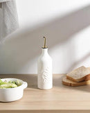 Sweejar Ceramic Olive Oil Dispenser Bottle 20 Oz Relief Opaque Oil Cruet Protects To Reduce Oxidation Suitable for Storage Vinegar, Soy Sauce, Coffee Syrup, Liquids, Set of 1 (White Gold Spout) by CozyNest Decor