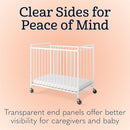 Foundations Chelsea Clearview Metal Compact Daycare Crib, 3" Casters, Compact Mini Size, Easy to Clean Durable Finish, Adjustable to Two Heights Mattress Board (White) by TinyTreasures Baby Boutique