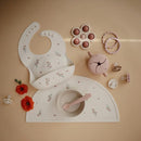mushie Silicone Baby Bib | Adjustable Fit Waterproof Bibs (Pink Flowers) by TinyTreasures Baby Boutique