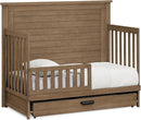 Delta Children Simmons Kids Caden 6-in-1 Convertible Crib with Trundle Drawer, Greenguard Gold Certified, Aged Oak by TinyTreasures Baby Boutique