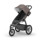UPPAbaby Ridge Jogging Stroller/Durable Performance Jogger with Never-Flat Tires/Built for Walking, Running, Hiking/Water Bottle Holder and Basket Cover Included/Theo (Dark Taupe/Carbon Frame) by TinyTreasures Baby Boutique